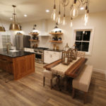 Kitchen and dining area in Cedar Brooke home by Weaver Barns